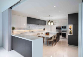 Contemporary Kitchen Design In A Condo With Island And Breakfast Table