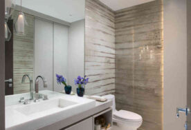 Luxury Powder Room Design With Custom Closet Wall And Impactful Stone