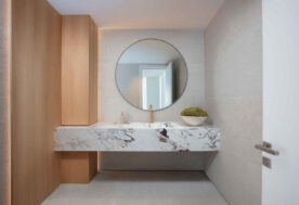 Natural, Neutral Bathroom Design Featuring A Wall Mounted Vanity.