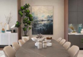 Dining Room Design Showcasing Accent Colors Adorned With A  Modern Brass And Glass Fixture.