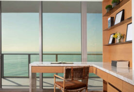 A Home Office Design Showcasing Wood Tones, Providing Warmth To Contrast The Coastal Ocean Views.
