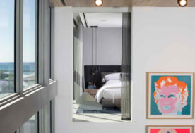 A Contemporary Oceanfront Retreat Home Featuring A View Of The Upstairs Bedroom.