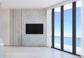 Sophisticated Armani Casa Condo Accessorized With A TV Offering An Ocean View.