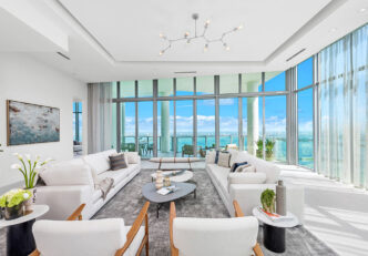 Real Estate Staging Project At Miami's Biscayne Beach Residence, Featuring A Spacious Living Room With Views Of The Cityscape And Waterfront.