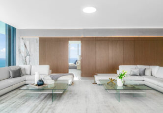 Real Estate Staging Project At Muse Residences Sunny Isles Featuring An Open-concept Living Room Area With A Bedroom Overlooking An Ocean View.