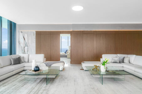 Real Estate Staging Project At Muse Residences Sunny Isles Featuring An Open-concept Living Room Area With A Bedroom Overlooking An Ocean View.