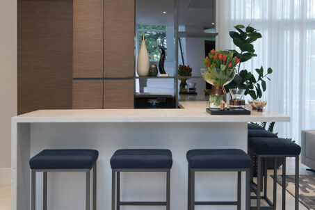 An Interior Design Residential Project Featuring A Custom L- Shaped Home Bar By DKOR Interiors.