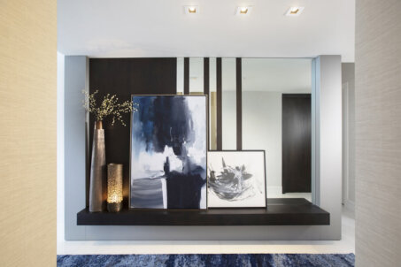 Foyer Design Ideas Adorned With A Mirror, Floating Console Table And Framed Art By DKOR Interiors.