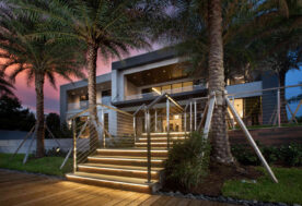Scenic Outdoor View Of A Golden Beach Home