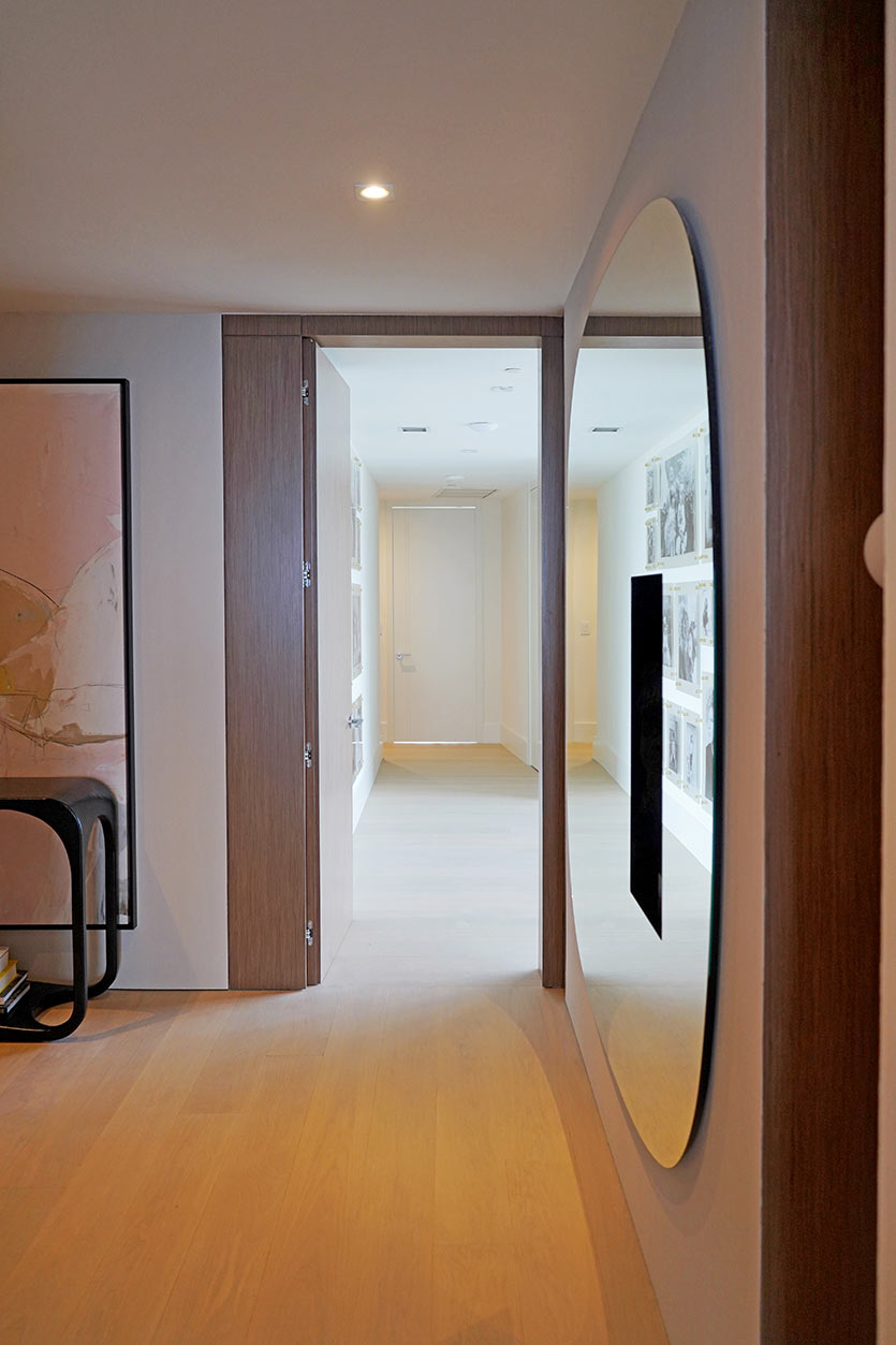 Condo Foyer Design with Large Mirror