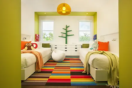 A vibrant kids bedroom design adorned with playful green colorblocking