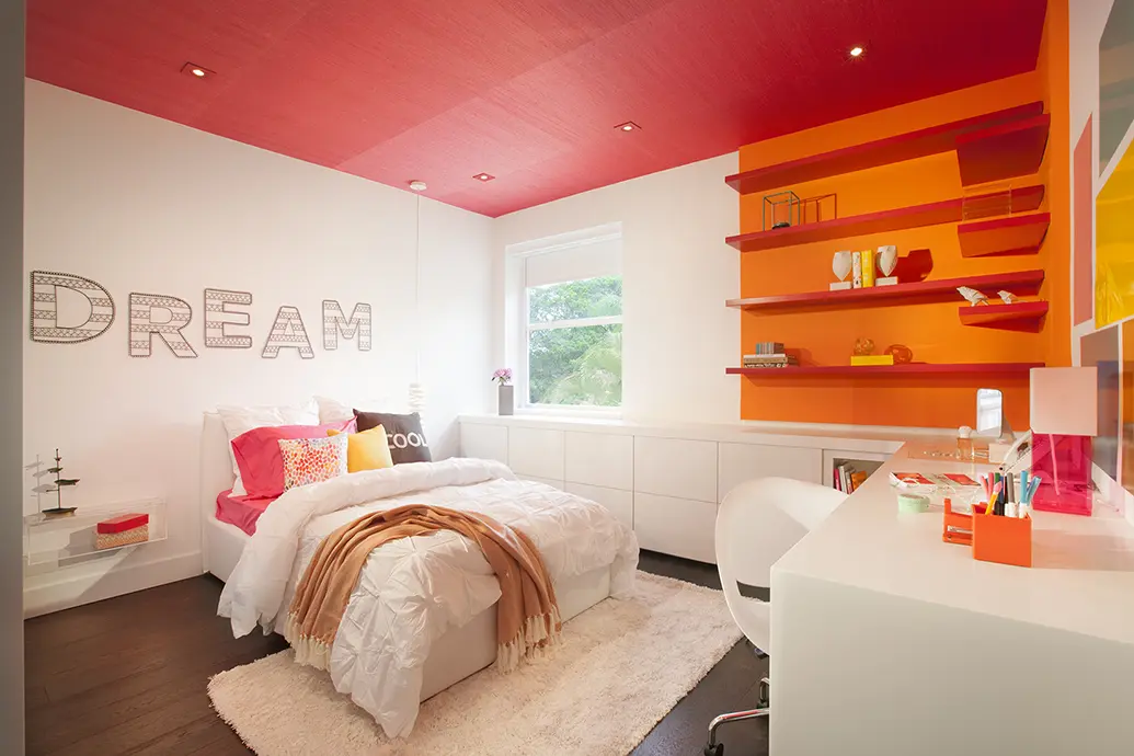 A photo of a girl's bedroom design with an accent ceiling in pink hues