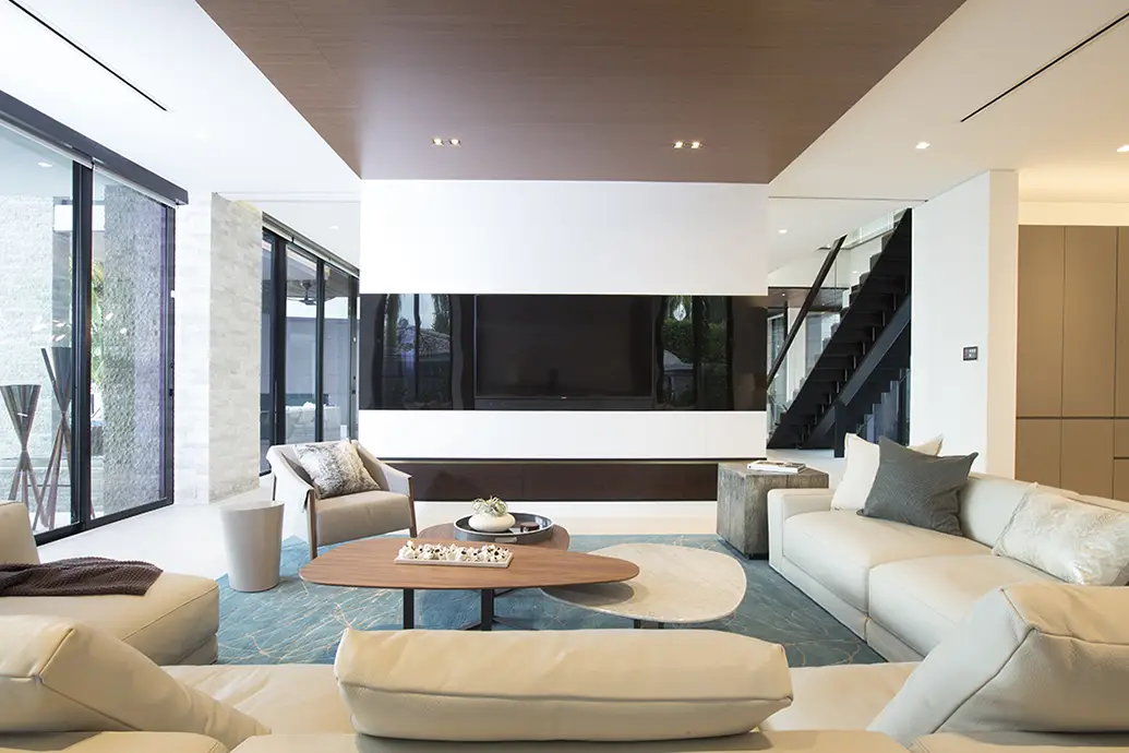 Photo capturing the elegance of a room adorned with a variety of coffee tables grouped together